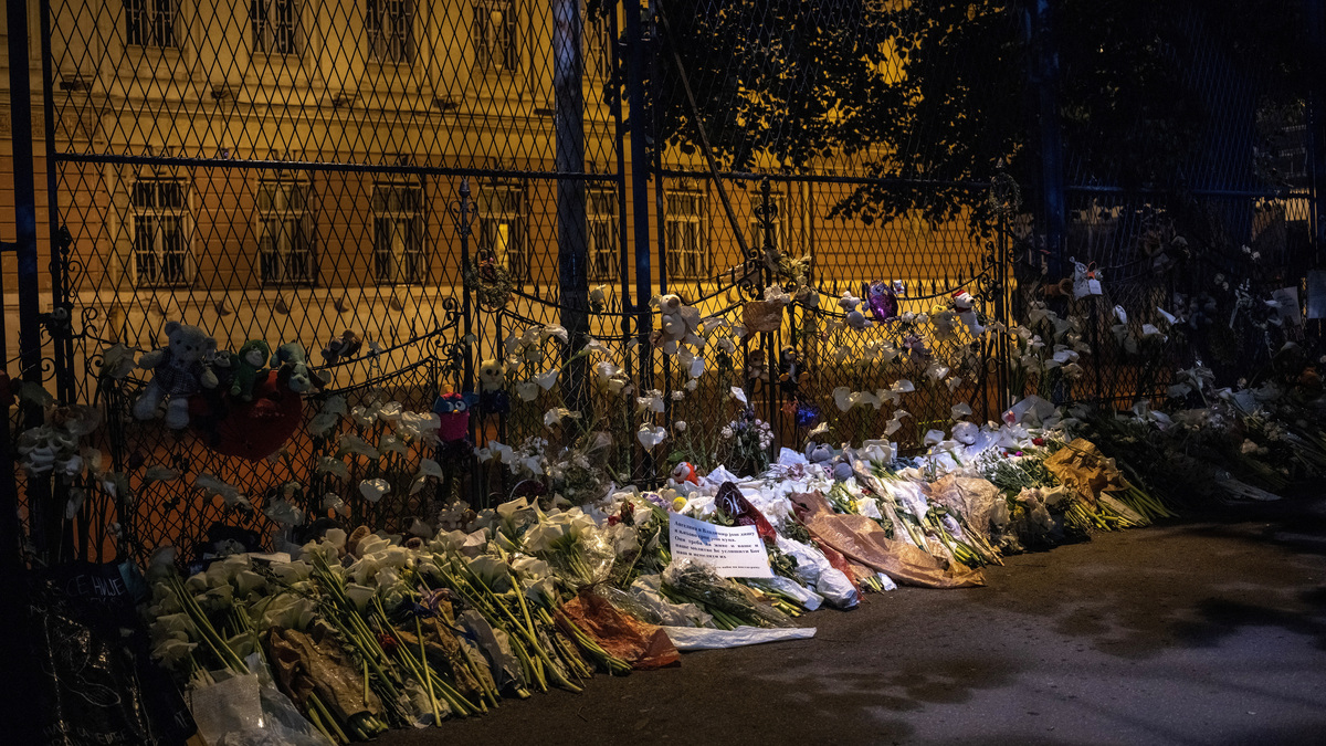 Flowers are laid to pay tribute to victims of the mass shooting at Vladislav Ribnikar school in Belgrade, Serbia, May 11, 2023. REUTERS/Marko Djurica