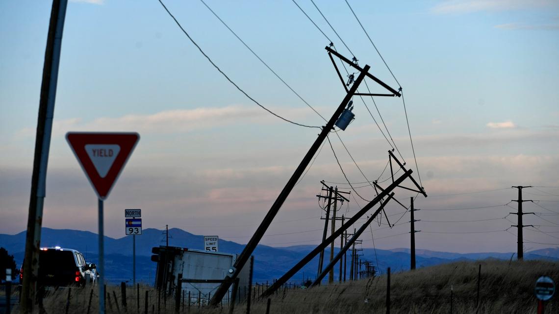 An overturned truck pushed high power lines over along Highway 93 as high winds created havoc along the front range on Dec. 15, 2021, in Superior, Colorado. (Helen H. Richardson/The Denver Post/TNS)