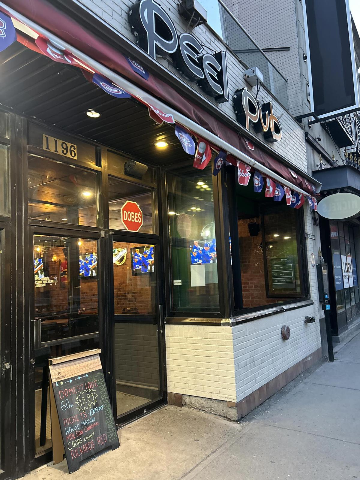  A pub has the Montreal Canadiens logo on full display at the entrance. (Michael Traikos-The Hockey News) 