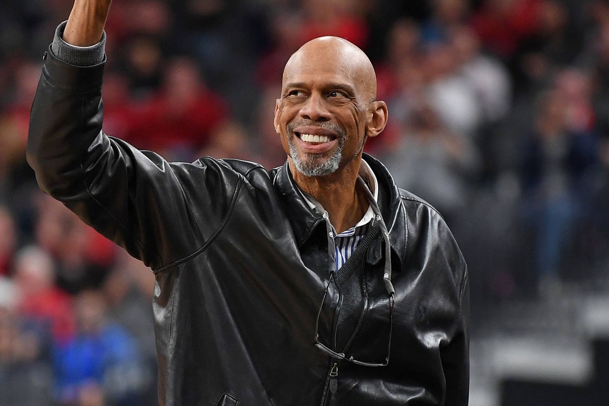  NBA legend Kareem Abdul Jabbar waves to fans. Stephen R. Sylvanie-Imagn Images