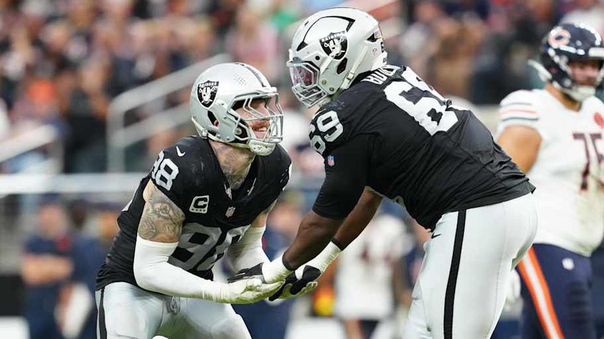  Sep 28, 2025; Paradise, Nevada, USA; Las Vegas Raiders defensive end Maxx Crosby (98) celebrates a play with defensive tackle Adam Butler (69) during the second half against the Chicago Bears at Allegiant Stadium. Mandatory Credit: Stephen R. Sylvanie-Imagn Images | Stephen R. Sylvanie-Imagn Images 