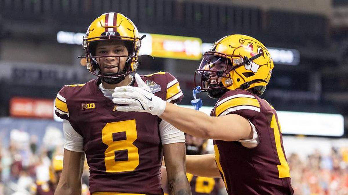  Dec 26, 2025; Phoenix, AZ, USA; Minnesota Gophers wide receiver Jalen Smith (8) celebrates with teammate Logan Loya (17) after catching the game winning touchdown pass against the New Mexico Lobos during overtime of the Rate Bowl at Chase Field. Mandatory Credit: Mark J. Rebilas-Imagn Images | Mark J. Rebilas-Imagn Images 