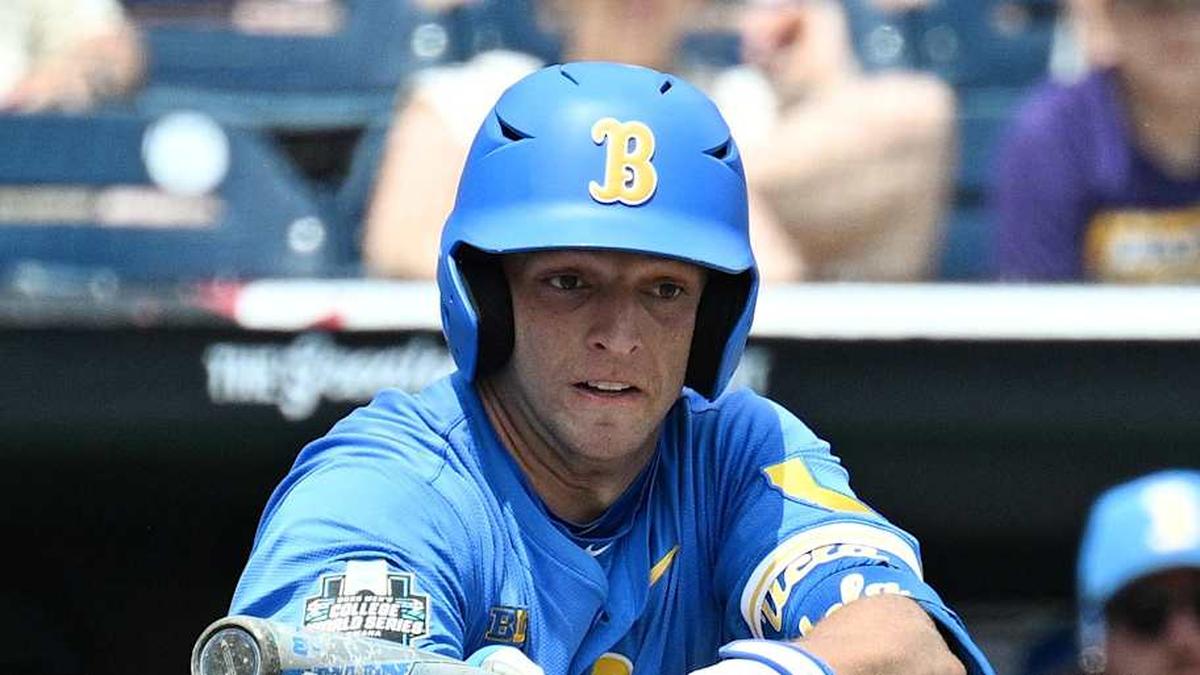  Jun 14, 2025; Omaha, Neb, USA; UCLA Bruins shortstop Roch Cholowsky (1) bunts in a run against the Murray State Racers during the fourth inning at Charles Schwab Field. Mandatory Credit: Steven Branscombe-Imagn Images | Steven Branscombe-Imagn Images 