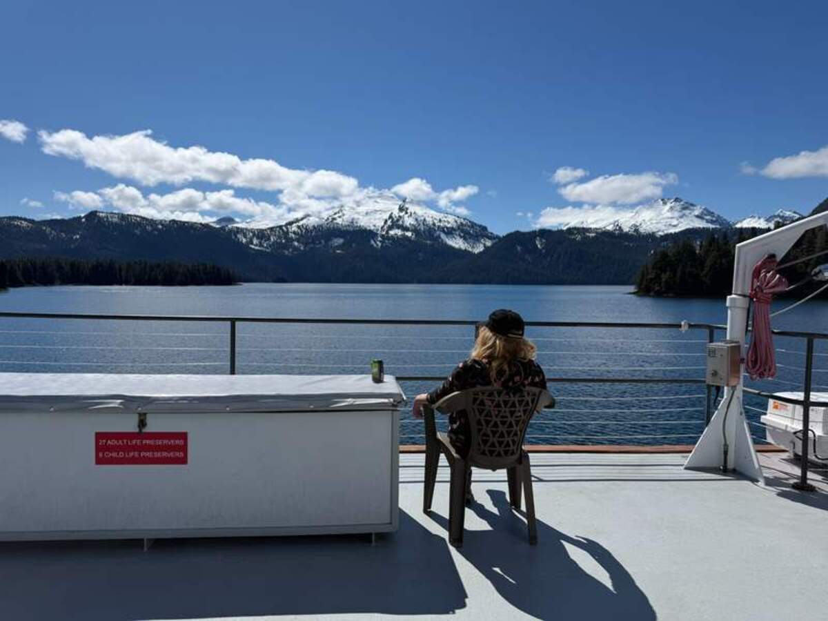  Megan finds a quiet place to relax on the sundeck. Photo credit: Mimi Slawoff 