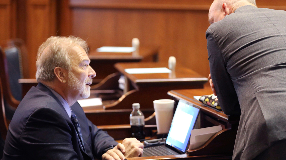 Democratic South Carolina Senate Minority Leader Brad Hutto, left, speaks to Senate Clerk Jeffrey Gossett before a debate on a bill banning abortion on Wednesday, Sept. 7, 2022, in Columbia, S.C. (AP Photo/Jeffrey Collins)