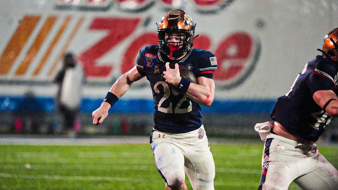  Navy's Eli Heidenreich (22) rushes with the ball during the Liberty Bowl game against the Cincinnati Bearcats on Jan. 2, 2026 at Simmons Bank Liberty Stadium in Memphis, Tenn. | Stu Boyd II-The Commercial Appeal / USA TODAY NETWORK via Imagn Images 