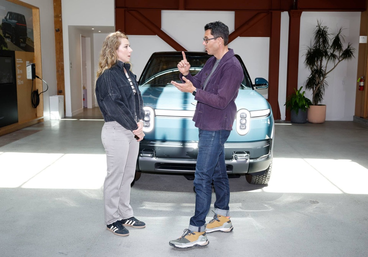 RJ Scaringe (R), founder and CEO of Rivian, has a clear-cut take on competing against Tesla. 