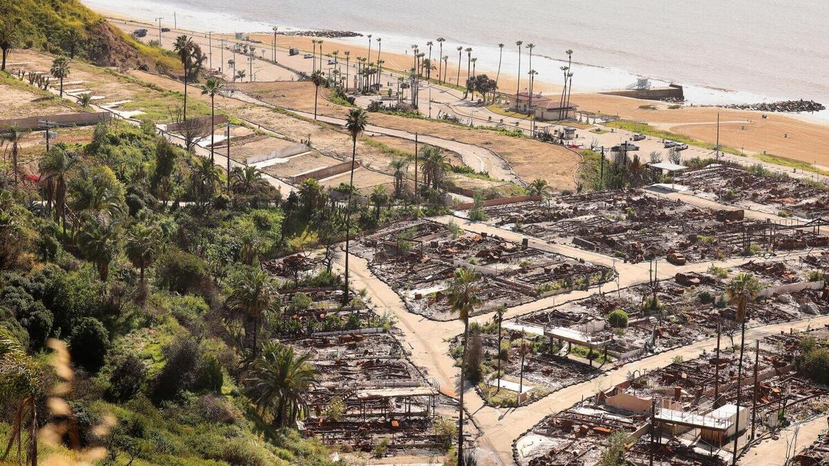 The Palisades Bowl Mobile Home Park, at right, and the Tahitian Terrace, at left, another mobile home park in Pacific Palisades, California, on Feb. 12. Los Angeles County Superior Court Judge Tiana Murillo turned down a petition by advocacy group Consumer Watchdog to halt wildfire charges, which insurers began levying last year after the state’s insurer of last resort couldn’t pay all its January 2025 fire claims.