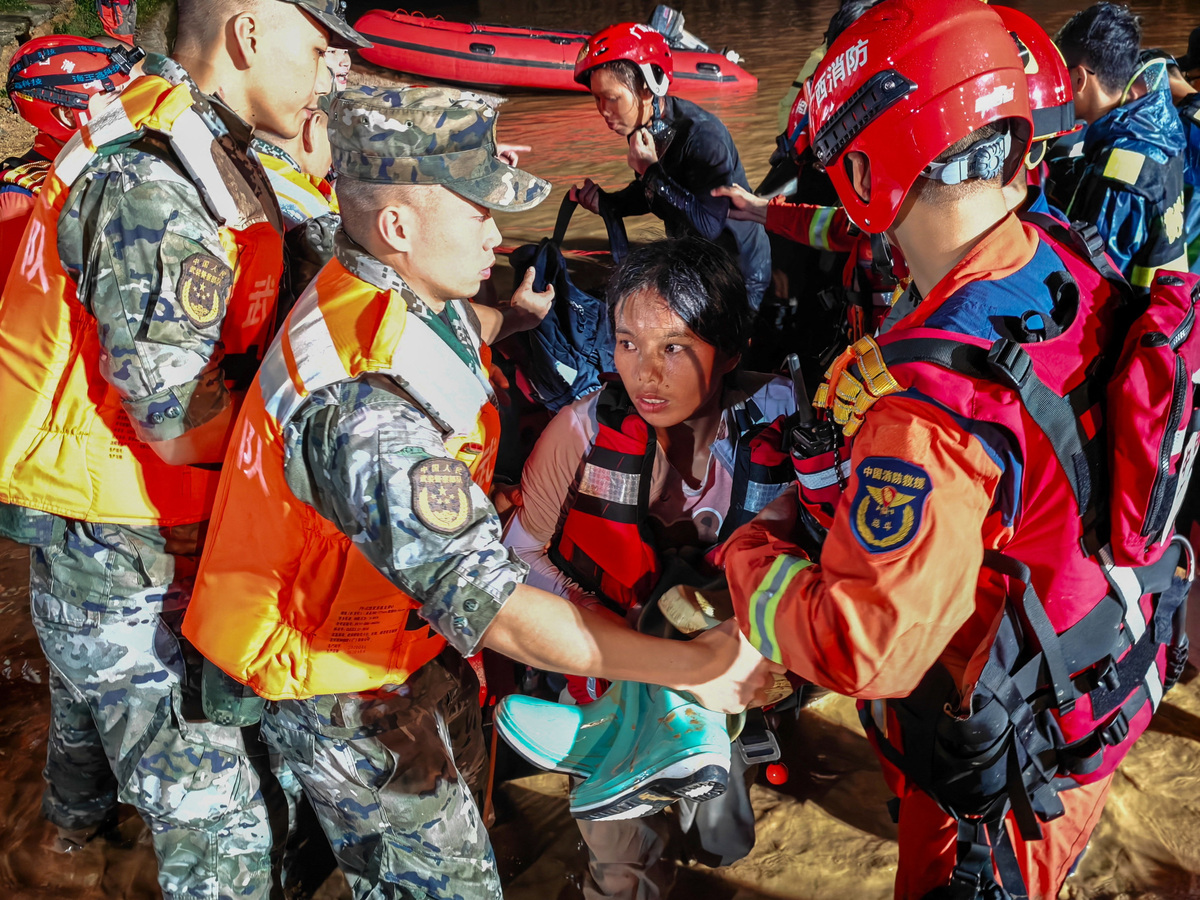 Rescue workers evacuate residents stranded by floodwaters after heavy rainfall brought by typhoon Maysak, in Hengzhou, Guangxi Zhuang Autonomous Region, China July 6, 2026. China Daily via REUTERS