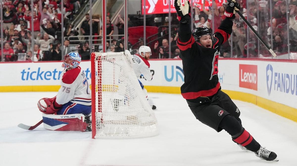 
                   May 29, 2026; Raleigh, North Carolina, USA; Carolina Hurricanes left wing Eric Robinson (50) reacts after scoring an even strength goal against Montreal Canadiens goaltender Jakub Dobes (75) in game five of the Eastern Conference Final of the 2026 Stanley Cup Playoffs during the first period during the first period at Lenovo Center. Mandatory Credit: James Guillory-Imagn Images 
                
