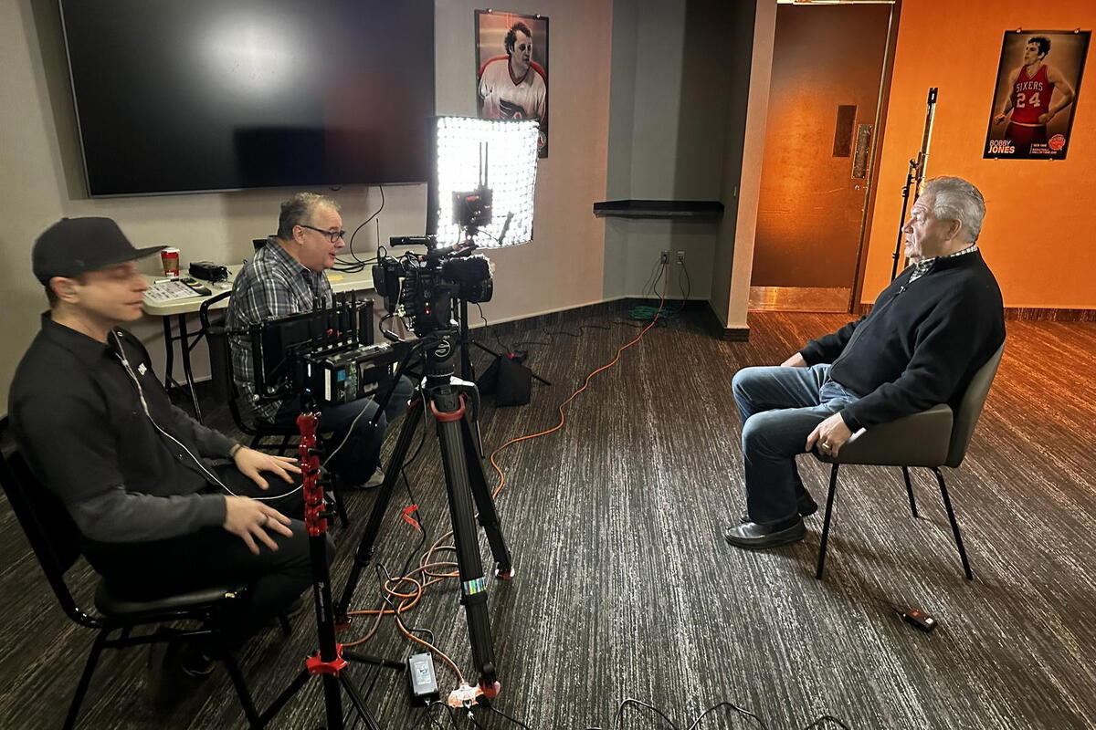  Cinematographer Bert Archer, left, and director Joe Amodei, center, interview former Flyer Dave Schultz for Cold War in Philly. (Courtesy of Joe Amodei) 