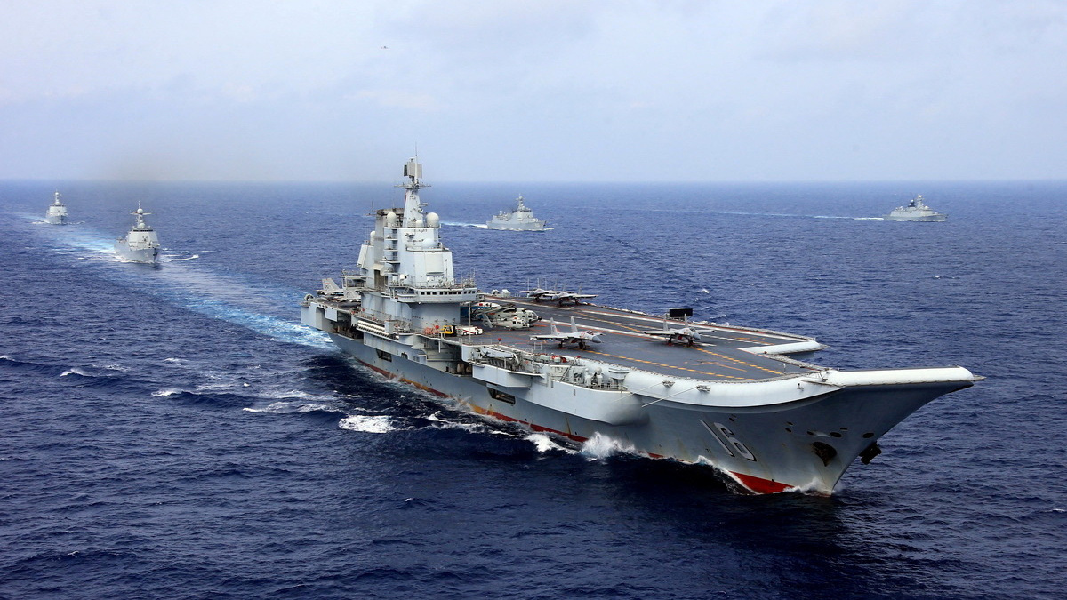 FILE PHOTO: China's aircraft carrier Liaoning takes part in a military drill of Chinese People's Liberation Army (PLA) Navy in the western Pacific Ocean, April 18, 2018.  REUTERS/Stringer File Photo