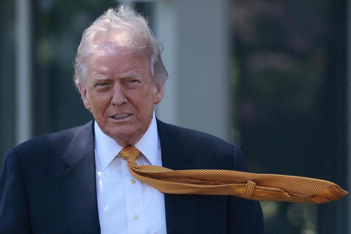 U.S. President Donald Trump walks ahead of departing the White House for Joint Base Andrews en route to Beijing, China, in Washington, D.C., U.S., May 12, 2026. REUTERS/Evelyn Hockstein