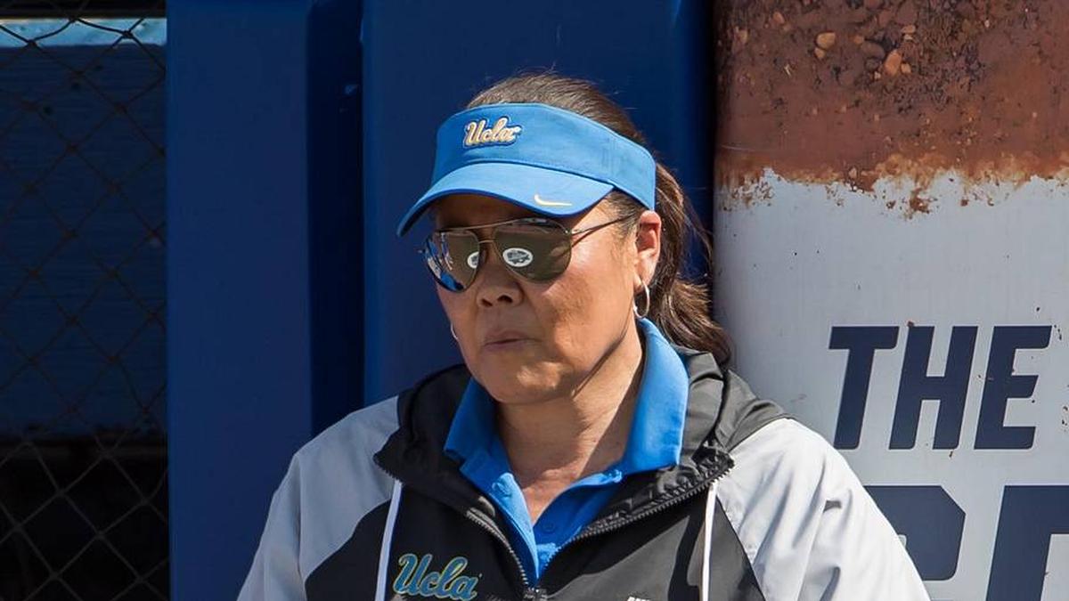 Jun 1, 2025; Oklahoma City, OK, USA; UCLA Bruins head coach Kelly Inouye-Perez waits on the umpire review of a scoring play in the seventh inning against the Tennessee Lady Volunteers during the NCAA Softball Women's College World Series at Devon Park. Mandatory Credit: Brett Rojo-Imagn Images | Brett Rojo-Imagn Images 