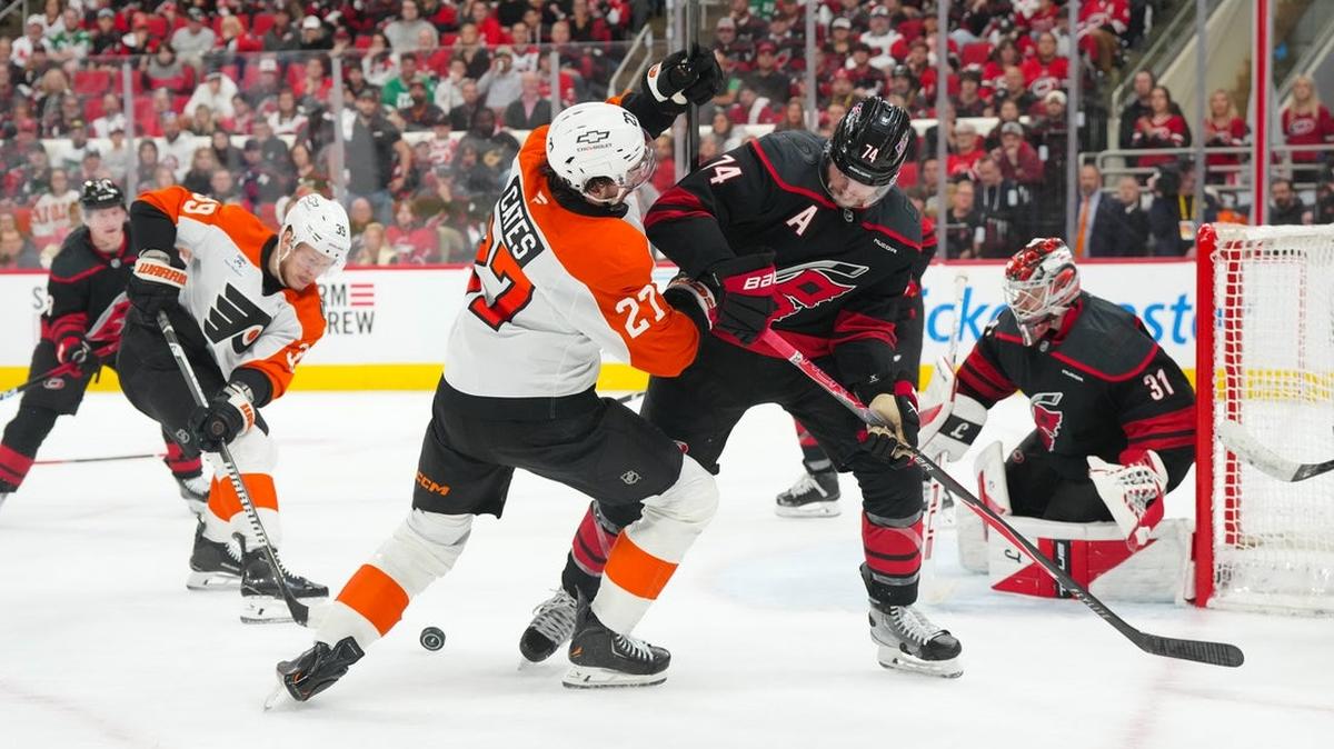 
                 May 4, 2026; Raleigh, North Carolina, USA; Carolina Hurricanes defenseman Jaccob Slavin (74) and Philadelphia Flyers left wing Noah Cates (27) battle over the puck in the first overtime in game two of the second round of the 2026 Stanley Cup Playoffs at Lenovo Center. Mandatory Credit: James Guillory-Imagn Images 
              