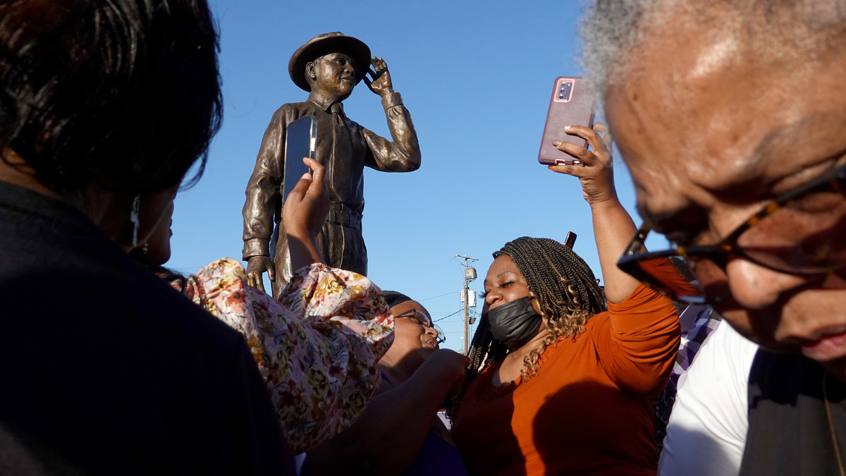 A statue of Emmett Till is unveiled on Oct. 21, 2022, in Greenwood, Mississippi. Till, 14, a Black teenager in town from Chicago visiting family in August 1955, was accused of flirting with Carolyn Bryant, a white woman. Till was later kidnapped from his uncle's home and murdered. His death is attributed to being the spark that ignited the civil rights movement.