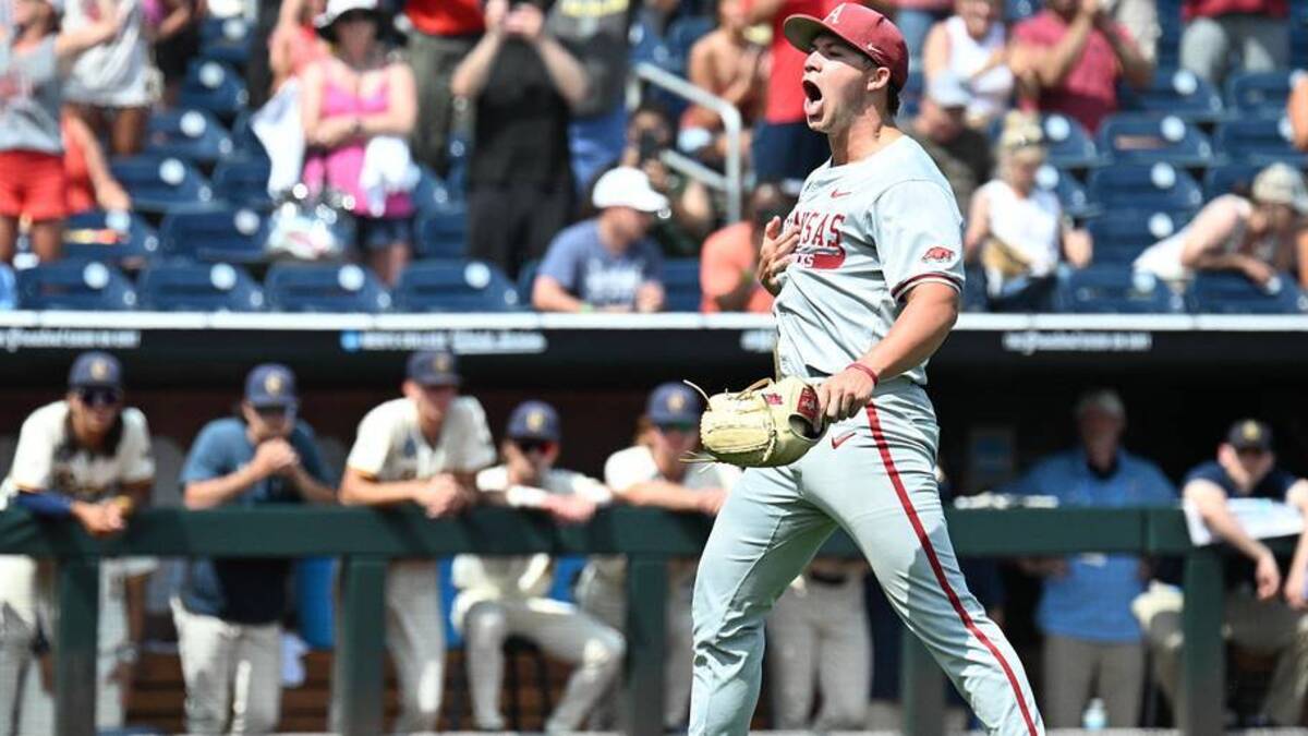  Jun 16, 2025; Omaha, Neb, USA; Arkansas Razorbacks starting pitcher Gage Wood (14) celebrates completing a no-hitter against the Murray State Racers at Charles Schwab Field. Mandatory Credit: Steven Branscombe-Imagn Images | Steven Branscombe-Imagn Images 