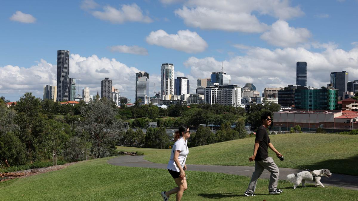 FILE PHOTO: People walk through Victoria Park-Barrambin, where the main stadium for the 2032 Olympics will be built, in Brisbane, Australia, December 8, 2025. REUTERS/Hollie Adams/File Photo