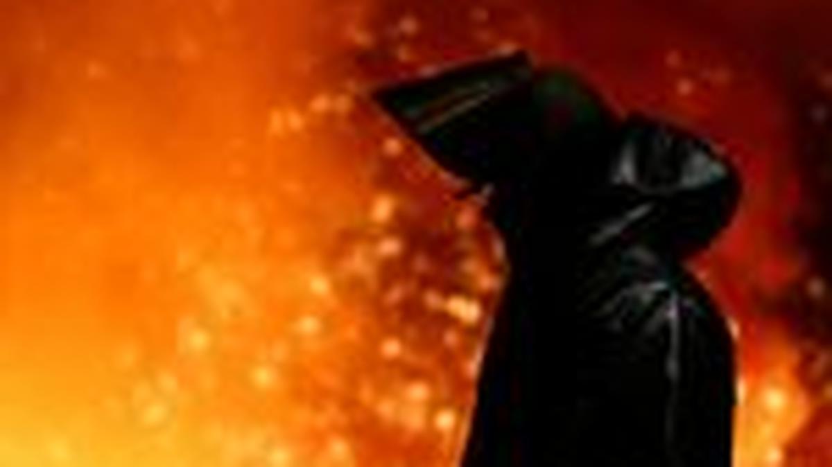 FILE PHOTO: A steel worker stands amid sparks of raw iron coming from a blast furnace at a ThyssenKrupp steel factory in Duisburg, Germany, November 5, 2025. REUTERS/Leon Kuegeler/File Photo
