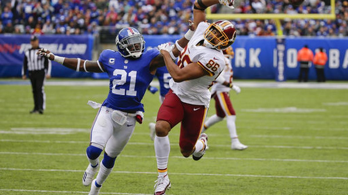 New York Giants strong safety Landon Collins (21) breaks up a pass intended for Washington Redskins tight end Jordan Reed (86) during the third quarter of an NFL football game, Sunday, Oct. 28, 2018, in East Rutherford, N.J.