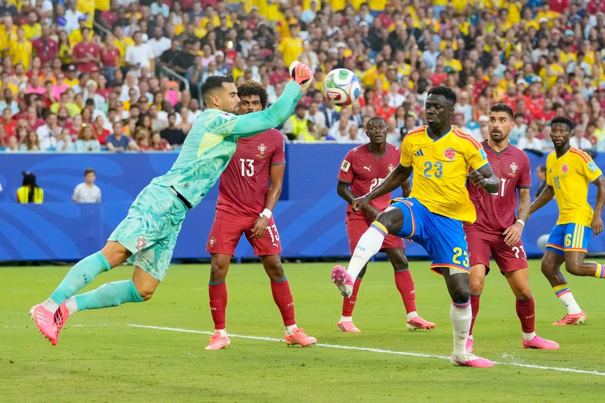  Goalkeeper Diogo Costa of Portugal and Davinson Sanchez of Colombia battle for the ball during the FIFA World Cup 2026 Group K match between Colombia and Portugal at Miami Stadium on June 27, 2026 in Miami, United States. (Photo by Alex Gottschalk/DeFodi Images/DeFodi via Getty Images) Photo by Alex Gottschalk/DeFodi Images/DeFodi via Getty Images