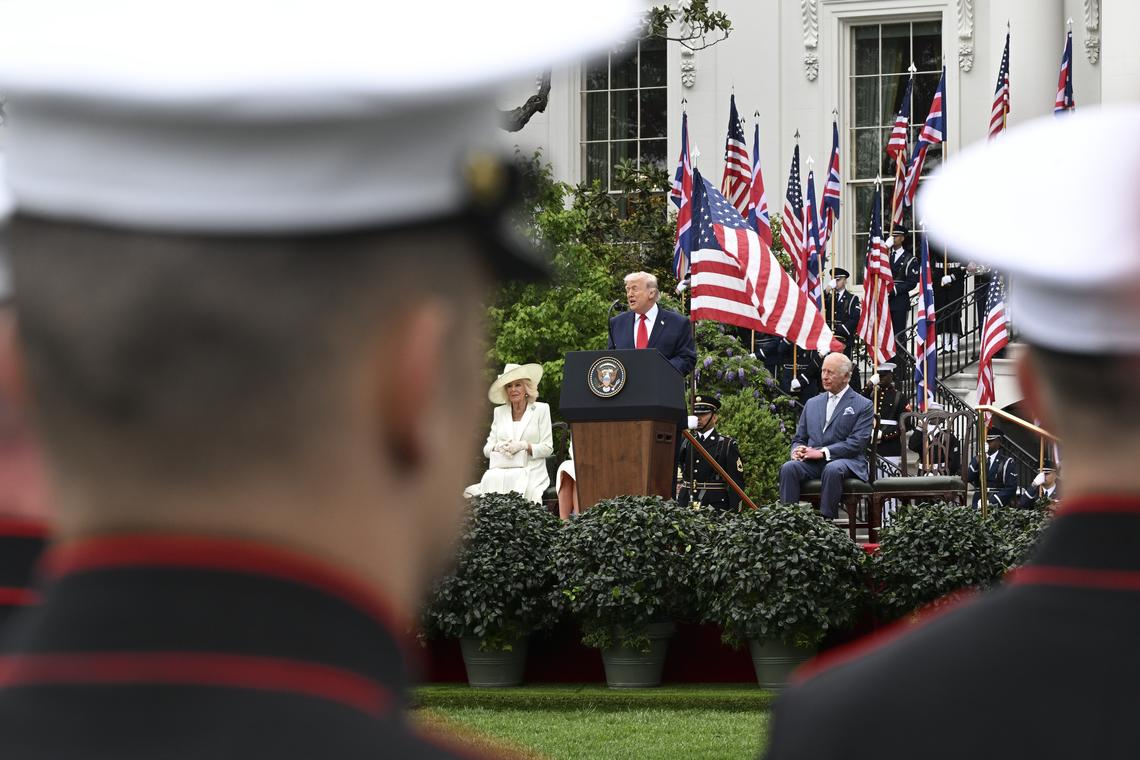 President Donald Trump speaks as King Charles III and Queen Camilla listen during an arrival ceremony on the South Lawn of the White House in Washington, on Tuesday, April 28, 2026. (Kenny Holston/The New York Times)