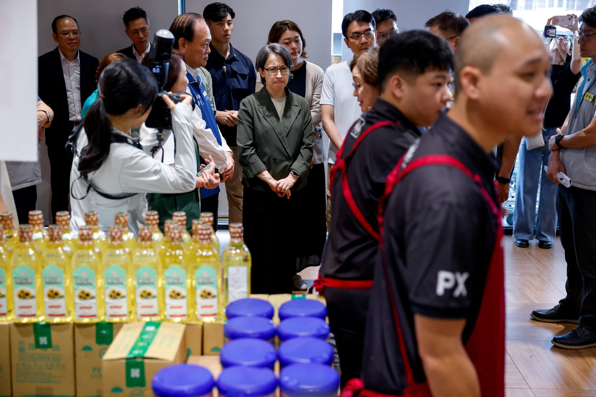Taiwan Vice President Hsiao Bi-khim observes a demonstration as people pick up rice, cooking oil and powdered milk at a supermarket during a resilience drill in Nantou, Taiwan, July 2, 2026. REUTERS/Ann Wang