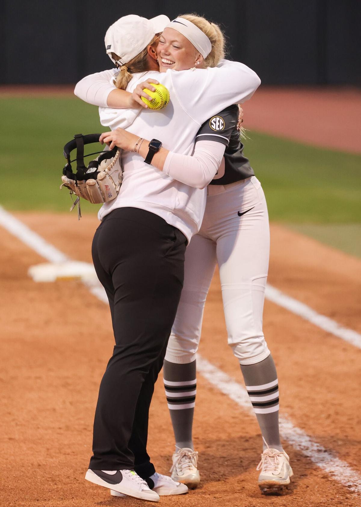 From left, Missouri Tigers softball coach Larissa Anderson embraces player Marissa McCann on Wednesday, April 22, 2026 at Mizzou Softball Stadium in Columbia. McCann had just pitched the 13th perfect game in program history as Mizzou beat SIUE 7-0.