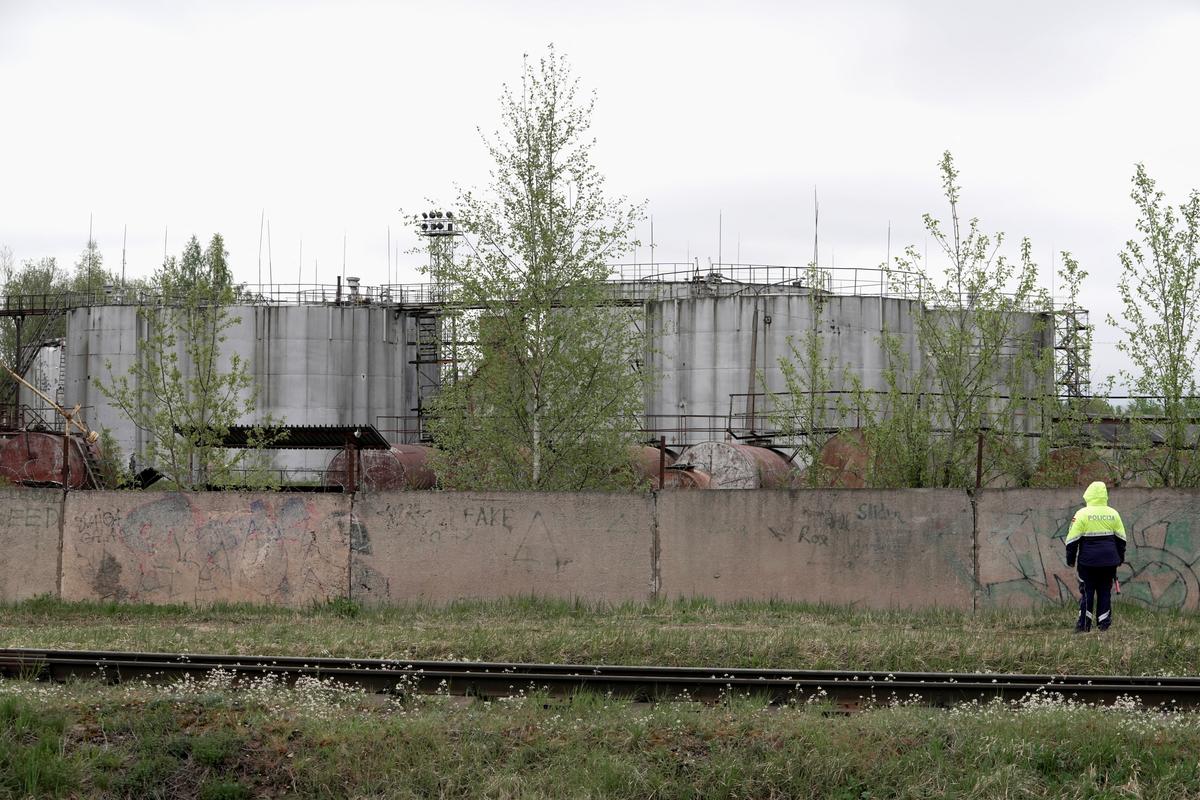 Oil tanks at the site where drones crashed at a storage facility in Rezekne, Latvia, May 7, 2026. REUTERS/Janis Laizans