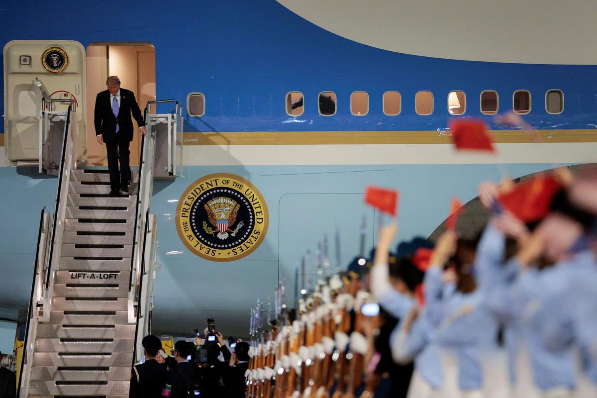 U.S. President Donald Trump participates in an arrival ceremony at Beijing Capital International Airport during his visit to the country, in Beijing, China, May 13, 2026. REUTERS/Evan Vucci