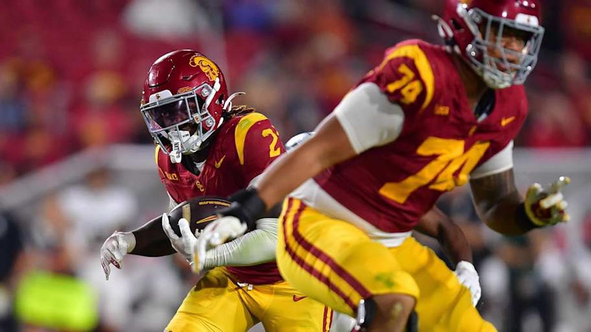  Sep 20, 2025; Los Angeles, California, USA; Southern California Trojans running back Waymond Jordan (2) runs the ball as offensive lineman Justin Tauanuu (74) provides coverage against the Michigan State Spartans during the second half at the Los Angeles Memorial Coliseum. Mandatory Credit: Gary A. Vasquez-Imagn Images | Gary A. Vasquez-Imagn Images 