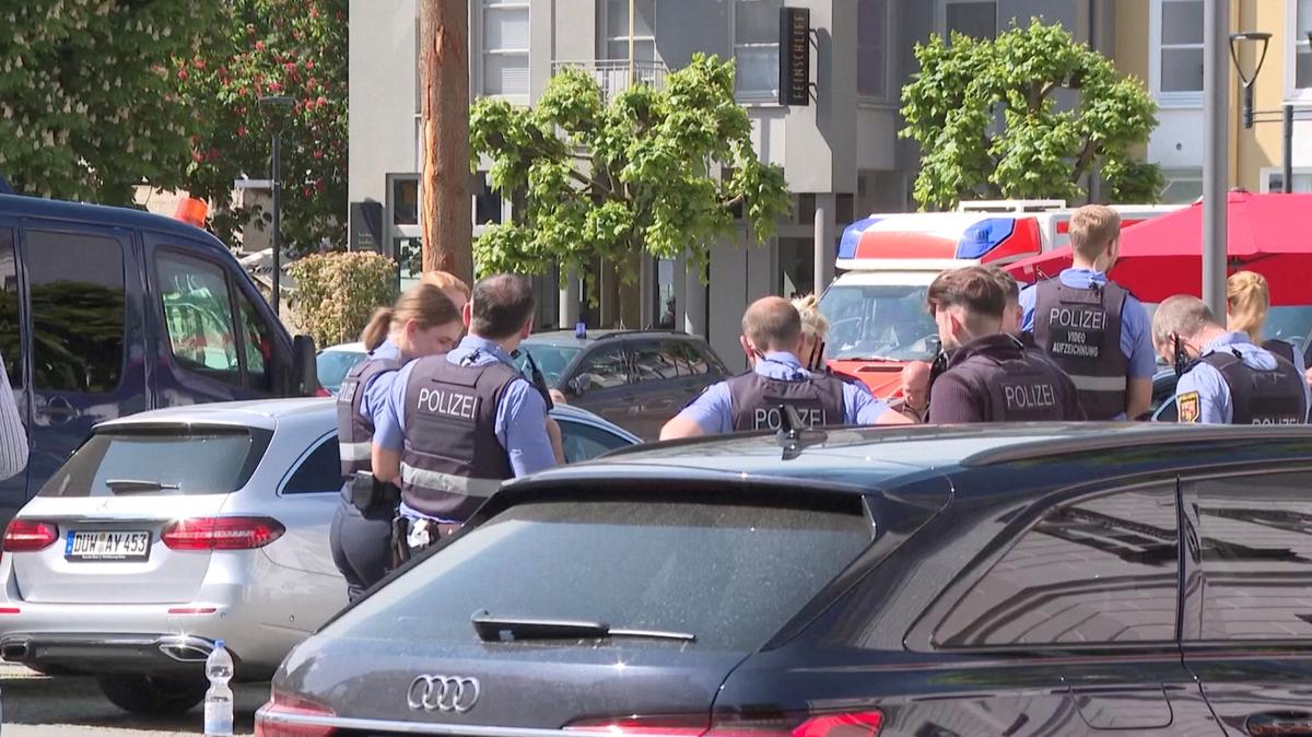 Police officers secure an area during operations in response to a hostage-taking situation, at a savings bank branch in the western town of Sinzig, near Bonn, in the state of Rhineland-Palatinate, Germany, in this screengrab obtained from video, May 8, 2026. REUTERS TV via REUTERS