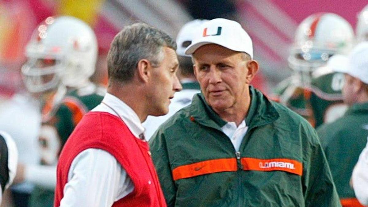  Ohio State's head football coach Jim Tressel chats with Miami's coach Larry Coker prior to their National Football Championships at the Sun Devil Stadium in Tempe, Arizona, January 3, 2003. | Neal C. Lauron/Columbus Dispatch / USA TODAY NETWORK via Imagn Images 