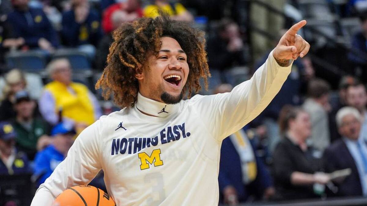  Michigan Wolverines guard Tre Donaldson (3) points to a fan in the crowd during warmups at Ball Arena in Denver, Colorado for the first round of the NCAA tournament against UC San Diego. | USA TODAY Network via Reuters Connect 