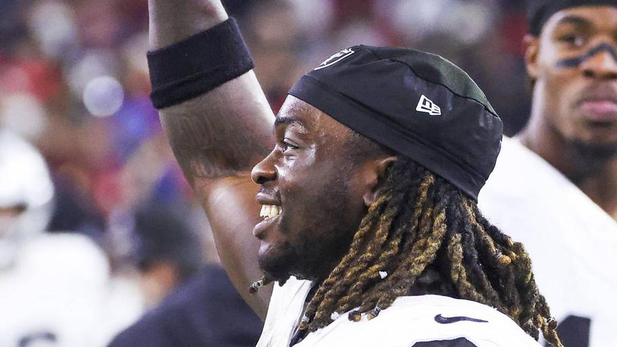  Dec 21, 2025; Houston, Texas, USA; Las Vegas Raiders running back Ashton Jeanty (2) holds a banana on the sideline after catching a touchdown pass against the Houston Texans during the third quarter at NRG Stadium. Mandatory Credit: Troy Taormina-Imagn Images | Troy Taormina-Imagn Images 