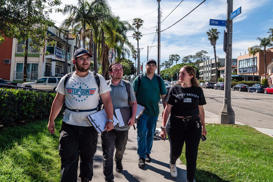 Zee Cohen-Sanchez, right, the founder of the Democratic organization National Ground Game, joins canvassers in going door-to-door in Long Beach, Calif., on April 4, 2026. "The left has been really terrible at connecting its work on the ground with its influencers online," Cohen-Sanchez says. (Ariana Drehsler/The New York Times)