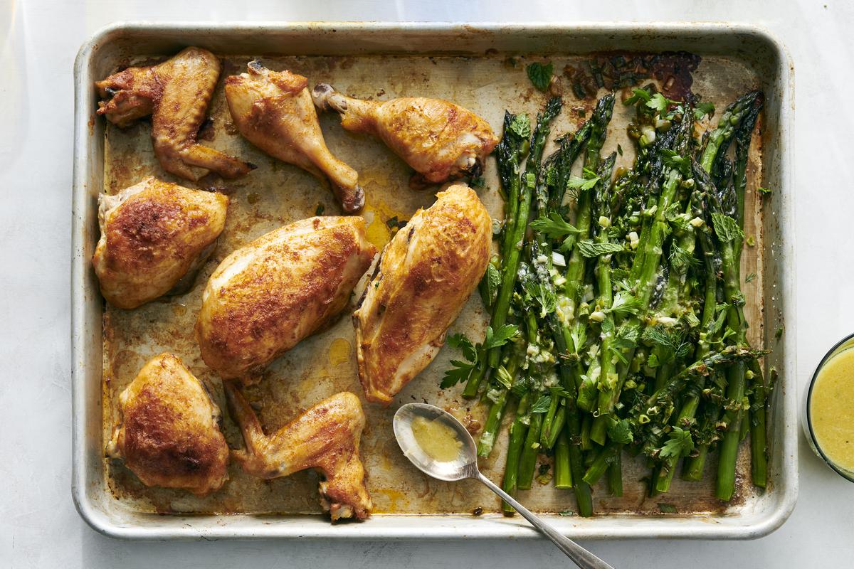 Lemon chicken with asparagus. The key here is to pile the asparagus into a mound, next to the chicken, so everything fits on the same pan. Food styled by Hadas Smirnoff. (David Malosh/The New York Times)