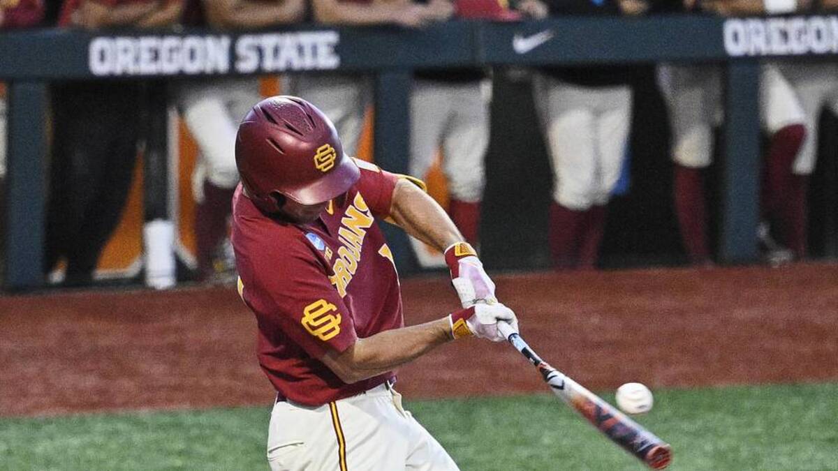  May 31, 2025; Corvallis, OR, USA; USC outfielder Jack Basseer (14) hits the ball during the eighth inning against Saint Mary's at the NCAA Corvallis Regional at Goss Stadium. Mandatory Credit: Troy Wayrynen-Imagn Images | Troy Wayrynen-Imagn Images 