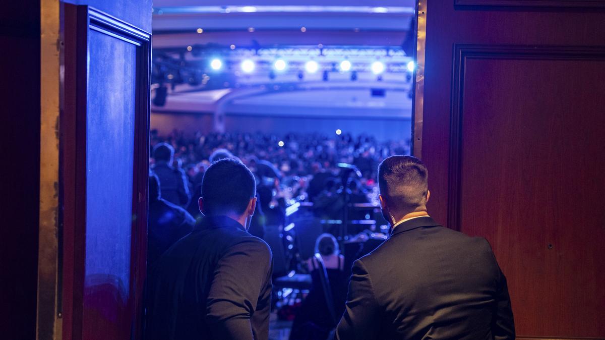 Members of the U.S. Secret Service rush into the White House Correspondents' Association dinner after gunshots were fired at the Washington Hilton in Washington on Saturday.