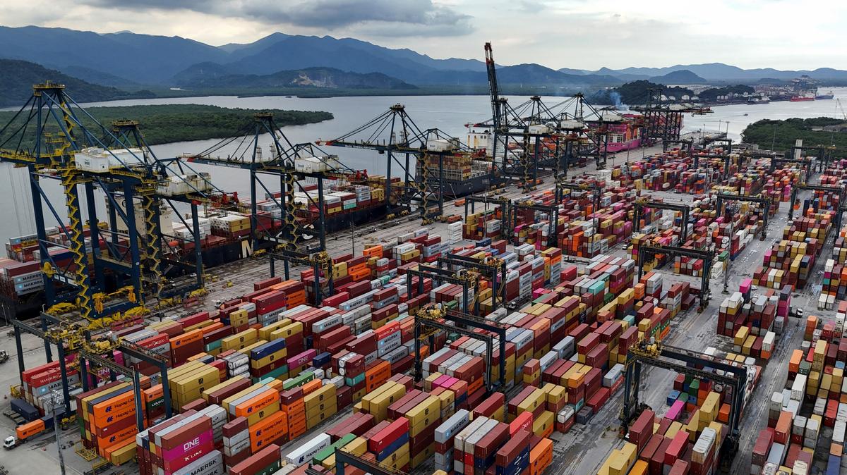 A drone view shows ships and containers at the Port of Santos, in Santos, Brazil April 3, 2025. REUTERS/Amanda Perobelli