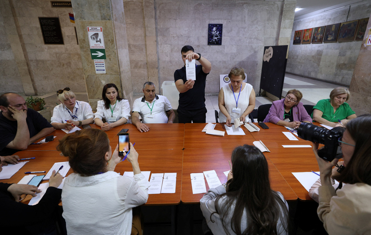 Members of an electoral commission count votes after polling stations closed in a parliamentary election in Yerevan, Armenia, June 7, 2026. Vahram Baghdasaryan/Photolure via REUTERS