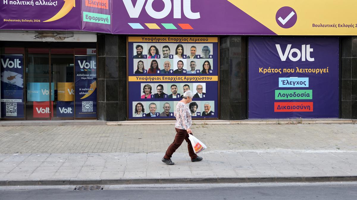 A woman walks in front of a Volt office before the forthcoming parliamentary elections on May 24, in Nicosia, Cyprus May 20, 2026. REUTERS/Yiannis Kourtoglou