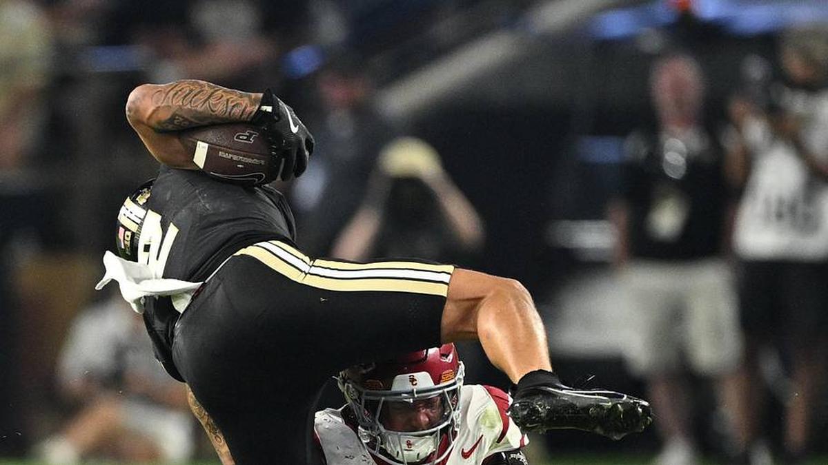  Sep 13, 2025; West Lafayette, Indiana, USA; Purdue Boilermakers wide receiver Michael Jackson III (2) is tackled by USC Trojans linebacker Desman Stephens II (23) during the second half at Ross-Ade Stadium. Mandatory Credit: Marc Lebryk-Imagn Images | Marc Lebryk-Imagn Images 