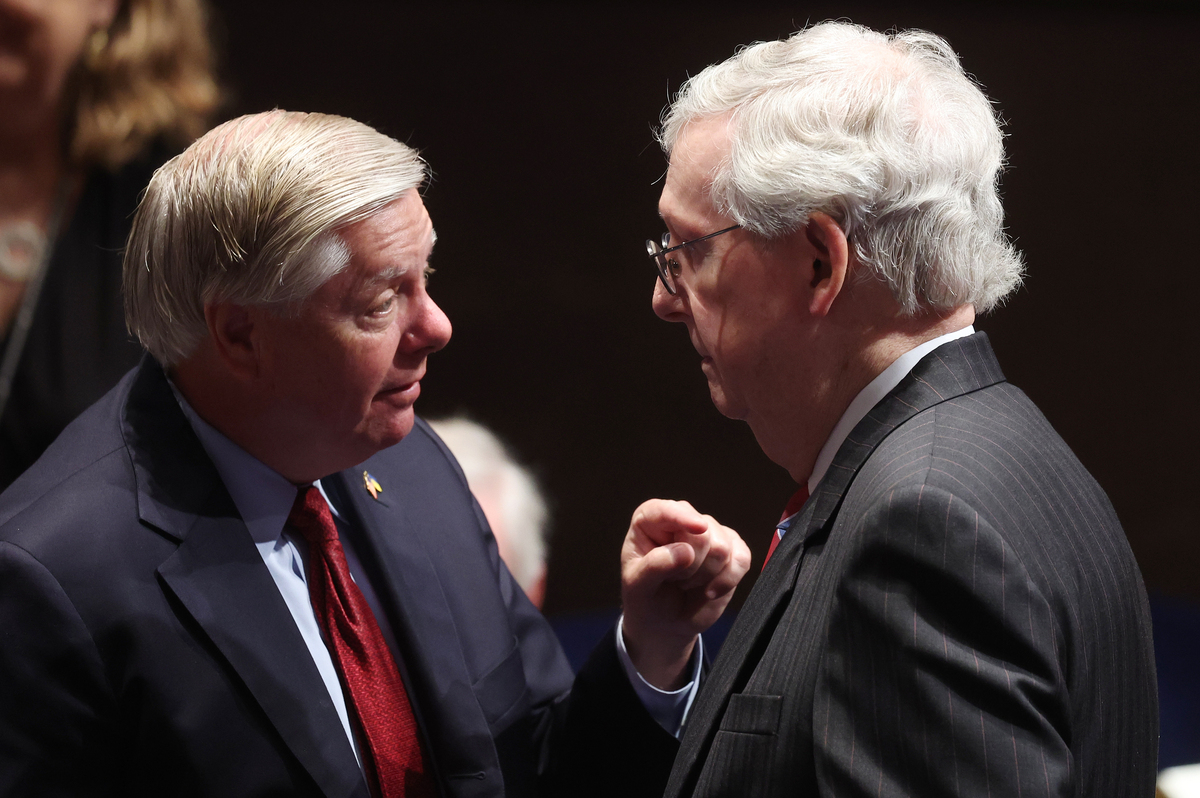  Senator Lindsey Graham, left, speaks with Senate Minority Leader Mitch McConnell at the U.S. Capitol on July 20, 2022, in Washington. (Photo by Michael Reynolds-Pool/Getty Images) 