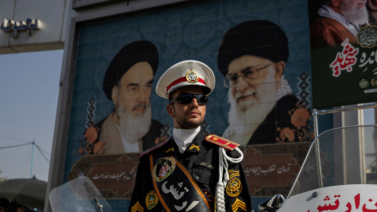 A police officer stands guard at the entrance of the Imam Khomeini Grand Mosalla, where a farewell ceremony for Supreme Leader Ayatollah Ali Khamenei, who was killed on February 28 in Israeli and U.S. airstrikes, takes place, in Tehran, Iran, on July 3, 2026. 