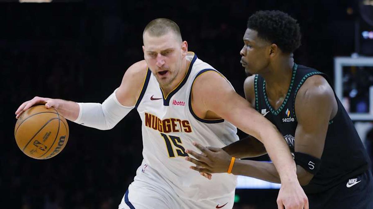  Apr 23, 2026; Minneapolis, Minnesota, USA; Denver Nuggets center Nikola Jokic (15) works around Minnesota Timberwolves guard Anthony Edwards (5) in the third quarter at Target Center. | Bruce Kluckhohn-Imagn Images 
