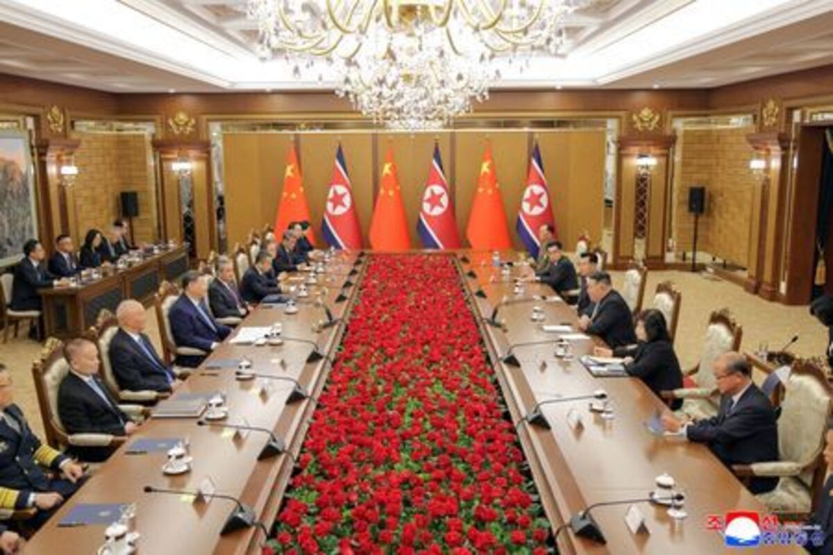 Chinese President Xi Jinping and North Korean leader Kim Jong Un sit facing each other during talks, amid Xi's state visit to Pyongyang, North Korea, June 8, 2026, in this picture released by North Korea's official Korean Central News Agency.   KCNA via REUTERS