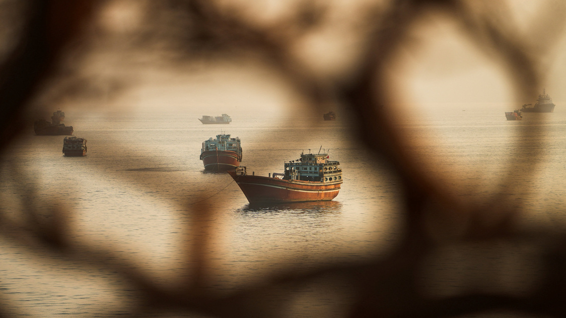 Two Singapore-registered vessels struck in Strait of Hormuz; one sinks