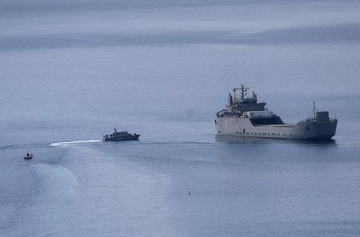 Greek Coast Guard vessels approach an Israeli vessel carrying activists of the Global Sumud Flotilla, which was intercepted on international waters by the Israeli Navy, off the port of Atherinolakkos, on the island of Crete, Greece, May 1, 2026. REUTERS/Stefanos Rapanis