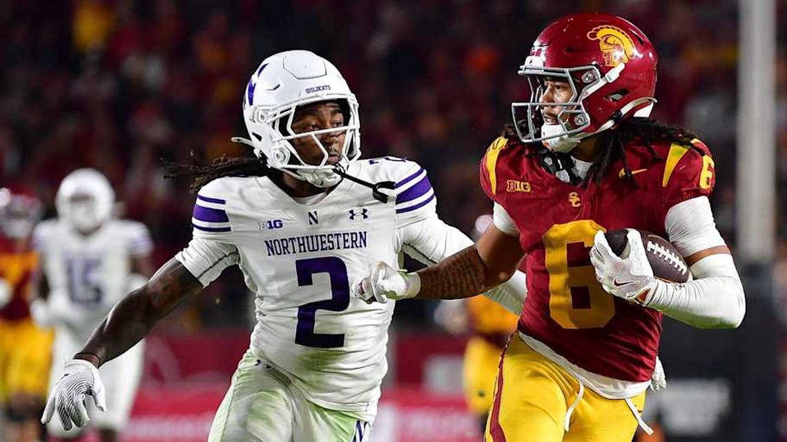 Nov 7, 2025; Los Angeles, California, USA; Southern California Trojans wide receiver Makai Lemon (6) runs the ball against Northwestern Wildcats cornerback Fred Davis II (2) during the second half at the Los Angeles Memorial Coliseum. Mandatory Credit: Gary A. Vasquez-Imagn Images | Gary A. Vasquez-Imagn Images 